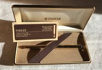 Pen in open Parker case with booklet