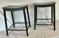 Front angled view showing both stools and overall design