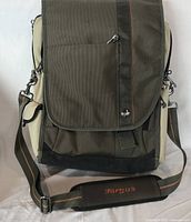 Front view of Targus backpack with flap closed and shoulder strap visible