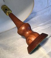 Close of teak base and brass socket