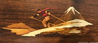 Top view of tray showing skier marquetry design