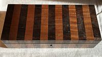 Top view showing striped rosewood and maple marquetry lid
