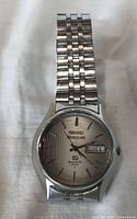 Front view of Seiko Motorcraft SQ 4004 watch showing dial, case, bracelet