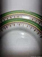 Stack of Aynsley Durham plates showing pattern and condition
