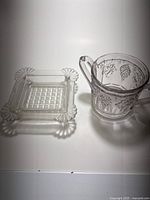 Overall view of square pressed glass dish and Paneled Grape creamer