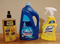 Front view of three unopened cleaning products
