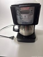 Front view showing Sunbeam coffee maker, control panel and carafe