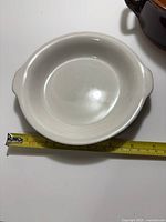 Hall ceramic casserole interior view with measuring tape showing size