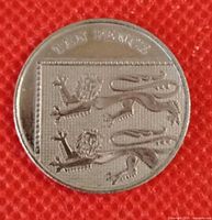 Reverse of UK 10 pence coin showing lions and TEN PENCE inscription