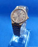 Front angled view of watch on stand