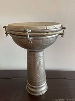 Full view of metal goblet drum on table