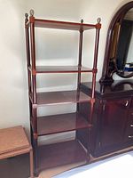 Full view of five-tier wooden shelf unit