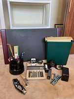 Full lot overview showing shredder bin, blotter, adding machine, caddy, staplers and accessories