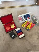 Group shot showing all playing card decks, poker chips and Venetian box