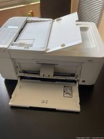 Front view of Canon Pixma TR4720 printer with output tray folded down