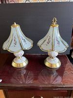 Front view of both matching glass touch lamps showing shades, bases and overall condition