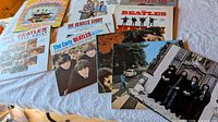 Beatles LPs spread including Long Tall Sally, Early Beatles, Abbey Road, Beatles Story etc.
