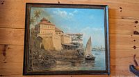Full view of framed coastal oil painting