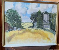 Full view of framed painting showing church, gravestones, field and sky