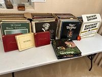 Tables displaying the entire vintage vinyl collection including boxed sets and 12" LPs
