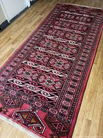 Full view of the runner rug laid flat on wood floor