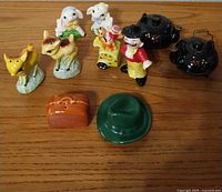 Overview of ten ceramic shakers showing all five pairs on wood surface