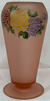 Front view of pink satin glass vase showing hand painted yellow, lavender, and maroon flowers