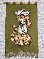 Full view of tapestry hanging from bamboo rod showing complete design and fringe