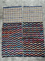 Two rugs with multicolour wavy stripe and checked section
