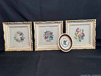 Front view of all four framed needlepoints