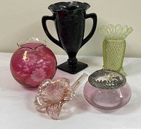 Group shot showing all five glass decor pieces