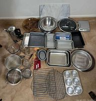 Entire lot laid out including kettle, pan, scale, cutting board, pans, bowls, etc.