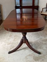 Table closed showing pedestal base and top surface