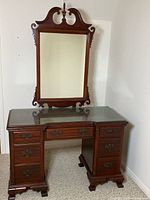 Front view of mahogany dressing table with mirror attached