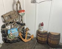 Group shot showing driftwood decor, anchor, barrels and lighthouse lantern