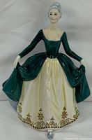 Front view of Royal Doulton Regal Lady figurine showing full attire