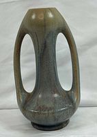 front view showing twin open handles and glaze coloration