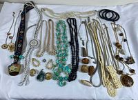 Entire assortment laid out showing necklaces, bangles, earrings, cuff