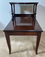 Front view of mahogany two-tier end table showing overall structure