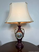 Full view of lamp lit with shade