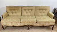 Front view of 3-seat gold jacquard sofa