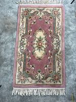 Full view of rug showing design and fringe