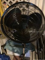 Black pedestal stand fan front view