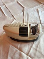 Cory knife sharpener side view showing branding and sharpening slot