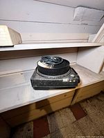 Front view of Kodak Carousel 800 projector with attached circular tray