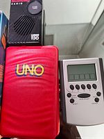 UNO case, pocket radio, handheld card game close-up