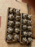 Top view showing all ten seltzer bottles in crate