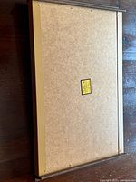 Back of warming tray showing full surface and wood-tone rails