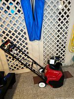 Left side view showing entire Toro Power Curve snow blower