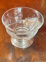 Clear glass bowl with etched pineapples on silver pedestal